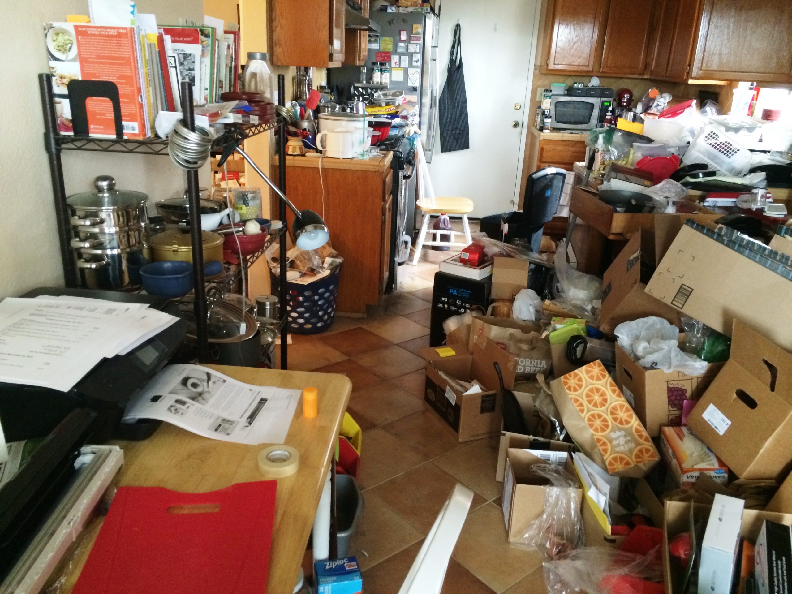 Kitchen cluttered with boxes, before organizing